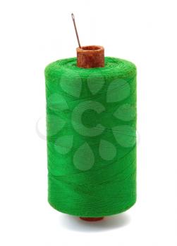 Green thread with needle on white background