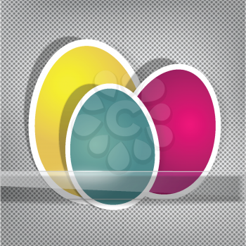 Easter eggs on metal surface and glass holder