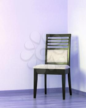 Empty chair on floor and  blank wall 