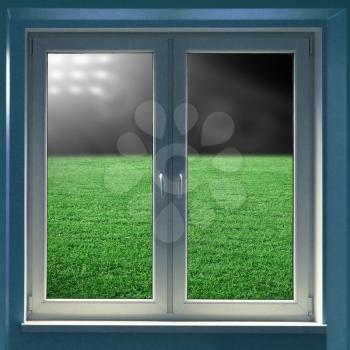 Windows with view to grass field in night