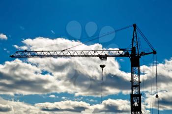 Royalty Free Photo of a Crane Against a Blue Sky