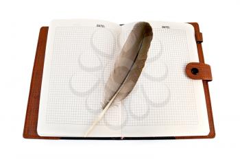 Royalty Free Photo of an Open Notebook With a Quill