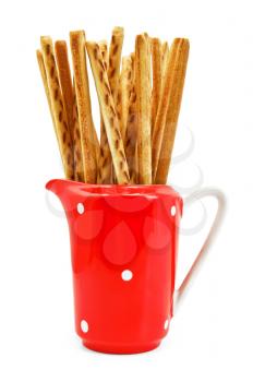 Bread sticks in red milkman isolated on a white background
