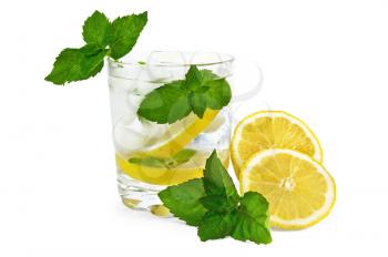 Iced water, lemon slices, mint in a glass beaker, sliced ??lemon on the table isolated on white background
