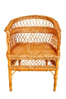 Woven from wooden twigs brown armchair isolated on a white background