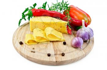 Cheese with spices and herbs, parsley, tarragon, sweet and hot peppers, bell pepper, garlic on a circular wooden board isolated on white background