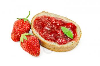 Slice of french bread with strawberry jam and mint, two strawberries isolated on white background