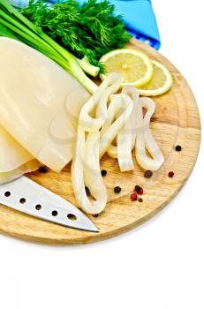 Squid whole and sliced ​​rings, lemon, dill, different peppers, blue napkin, a knife on a wooden board isolated on white background