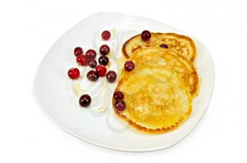 Pancakes with cranberries and honey on a plate isolated on white background