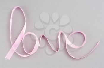 Royalty Free Photo of the Word Loved Spelled in Ribbon