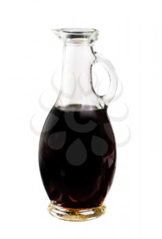 Small decanter with balsamic vinegar isolated on the white background