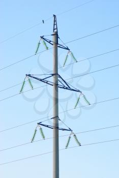 High voltage electricity pillars  on the blue  sky background 