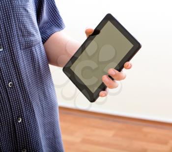 Royalty Free Photo of Hands Holding a Tablet