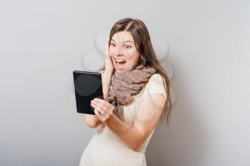 girl looks in a mobile tablet