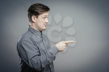 young  man pointing at someone gesture with finger