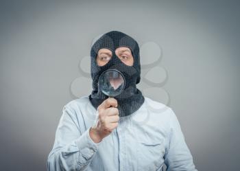 Man Wearing Mask and magnifier