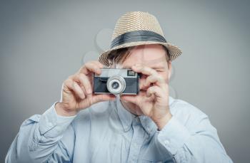 portrait of stylish handsome man with camera