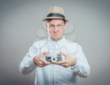 portrait of stylish handsome man with camera