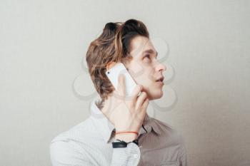 young man talking on a cell phone