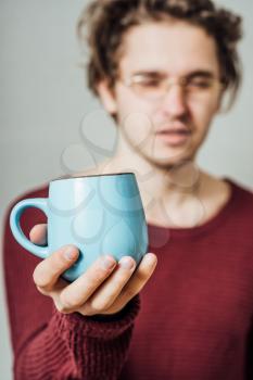 Man holding a cup of coffee 