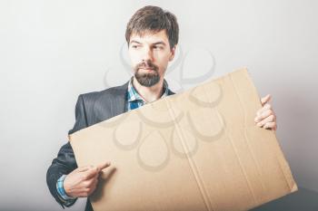 businessman with cardboard Inscription