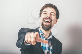 bearded businessman points finger and taunts