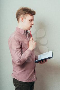 man planning calendar with a notebook and pencil