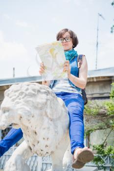 female tourist looking map
