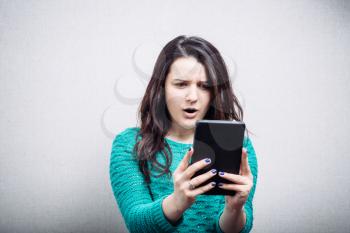 girl looking at mobile tablet