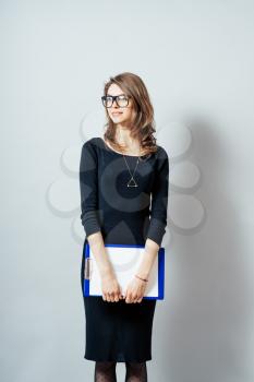 Portrait of smiling business woman with paper folder