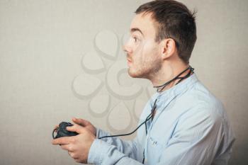 young man holding video game joystick.