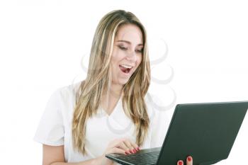 A woman doctor is surprised and looking at her laptop. 