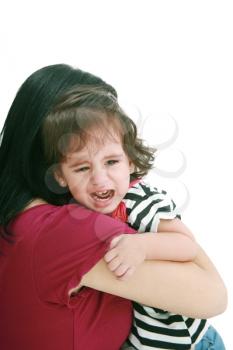 Little girl crying in mothers arm, isolated on white