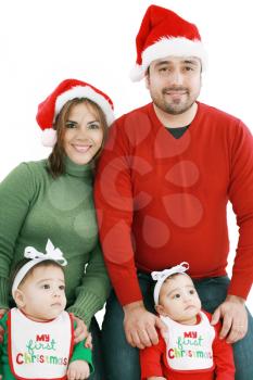 Happy family in Christmas costumes 
