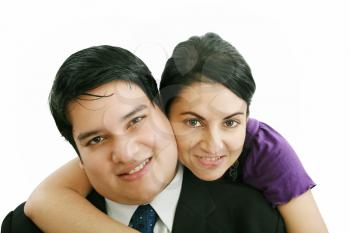 Portrait of a beautiful young happy smiling couple - isolated 

