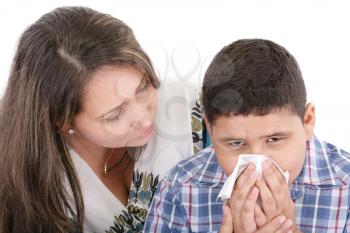Child blowing nose. Child with tissue. catarrh or allergy 