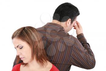 Young couple standing back to back having relationship difficulties. Focus on woman