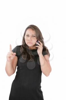 a woman with a serious expression on her face holding her phone up to her ear.
