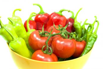 Royalty Free Photo of a Bowl of Peppers and Tomatoes