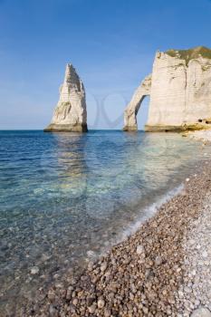 The famous cliffs at etretat from the rocky beach