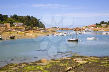 Harbor in Ploumanach and pink granite coast of Brittany, France