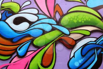 Detail of a colorful graffiti art on a wall, abstract background