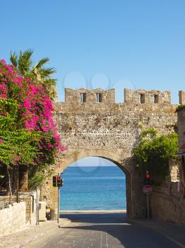 View at mediterranean sea through the Milon gate of Rhodes old town, Greece