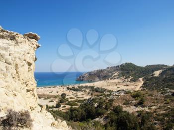 View on Tsampika beach and Mediterranean sea with the rock in foreground. Rhodes island, Greece.