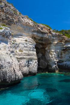 Pirate coast cliff cave at Menorca island, Spain.