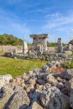 Talaiot de Trepuco megalithic table-shaped Taula monument in sunny day at Menorca island, Spain.