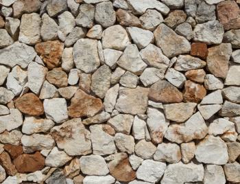 Seamless rough medieval  stone wall background.