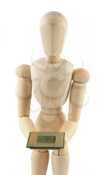 Royalty Free Photo of a Wooden Mannequin Standing and Holding a Microchip