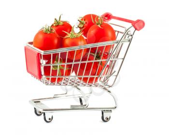 Ripe red tomatoes in shopping cart isolated on white background