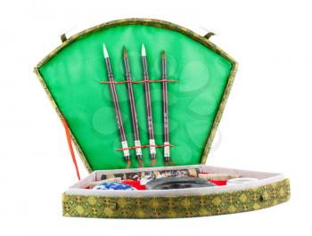 Chinese calligraphy set with brushes in box. Isolated on white background.